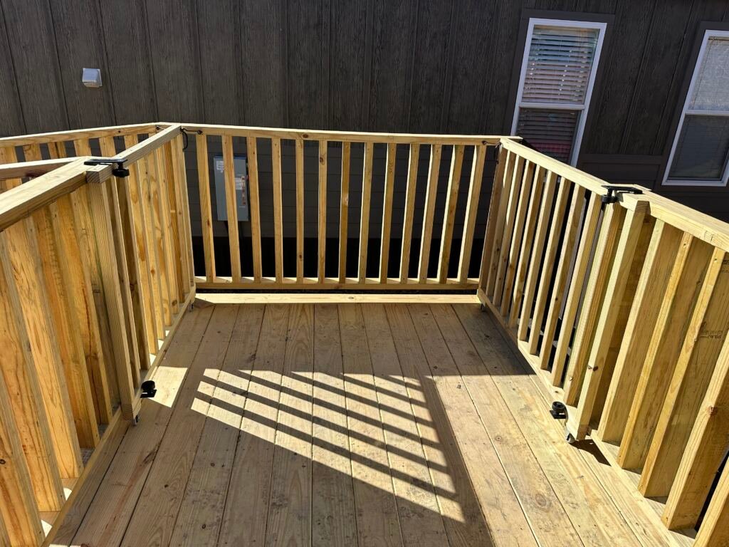 Deck with a ramp by Berglund Services