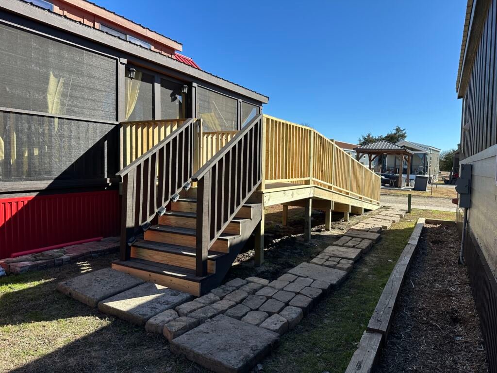 Deck with a ramp by Berglund Services